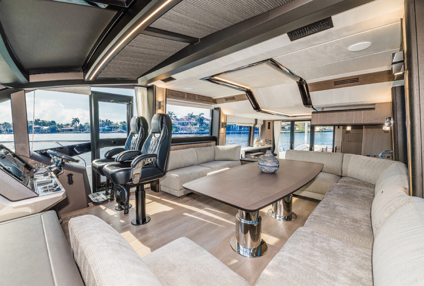 Main-deck salon: twin helm seats and wraparound sofa